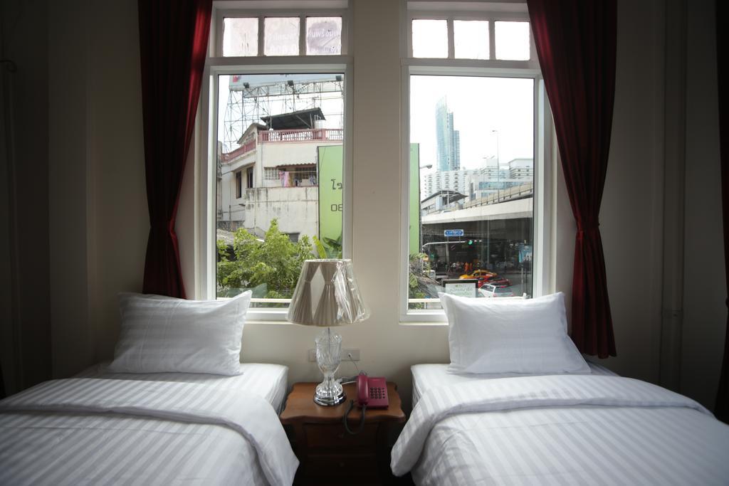 Chambre d'Angle Lits Jumeaux - Vue sur Ville